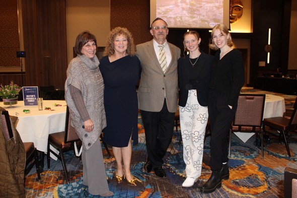 Mayor Nancy Backus poses with guests at State of the City event in ballroom.