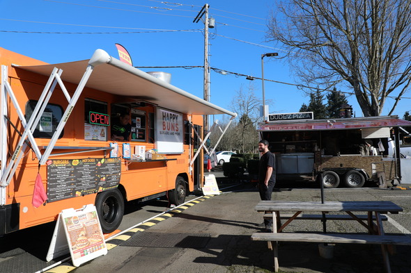 Two food trucks in a pod 