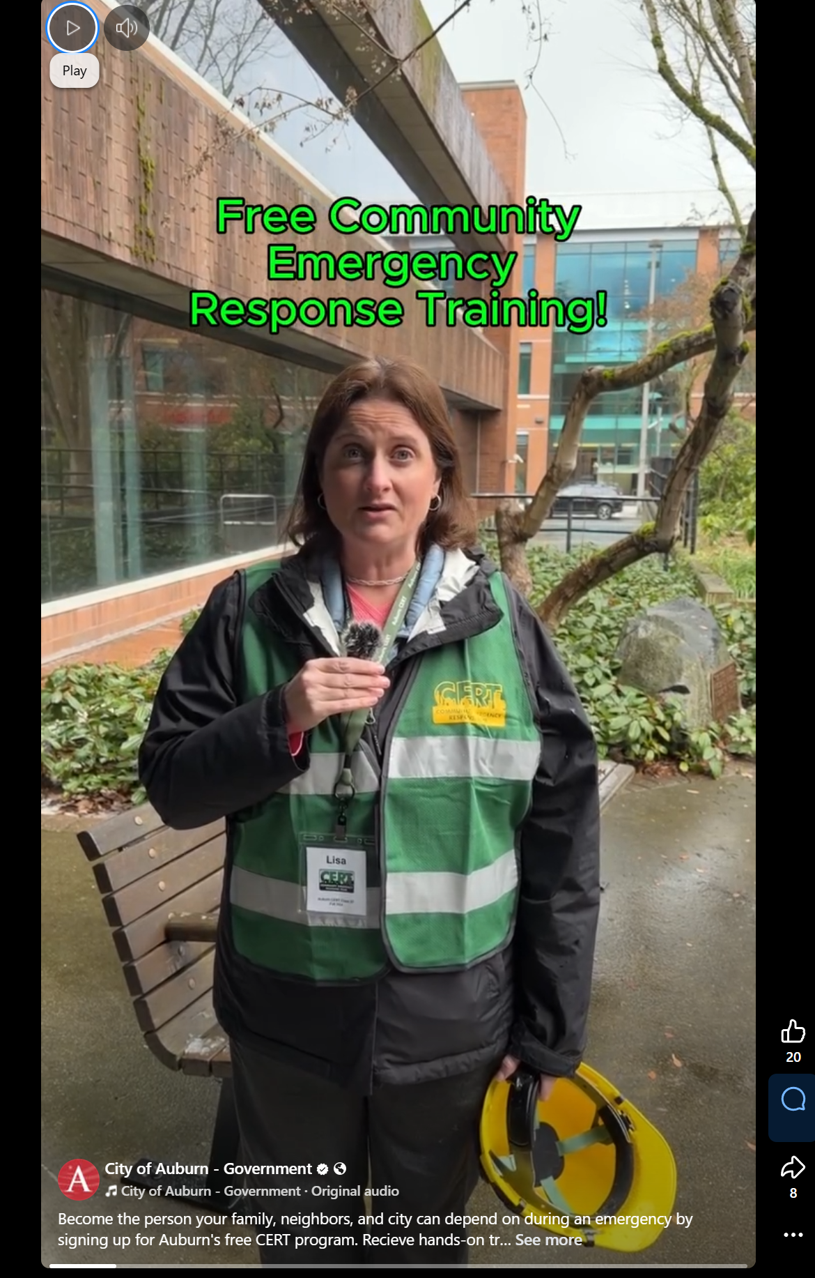 Woman in green CERT vest speaks about free Community Emergency Response Training outside a city building.