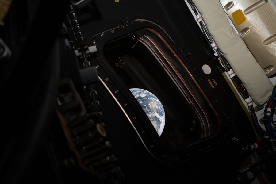 Earth, pictured from inside a space shuttle 