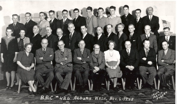 Black-and-white 1945 group portrait of men and women posed in rows, labeled Auburn, Washington, Nov. 6, 1945.