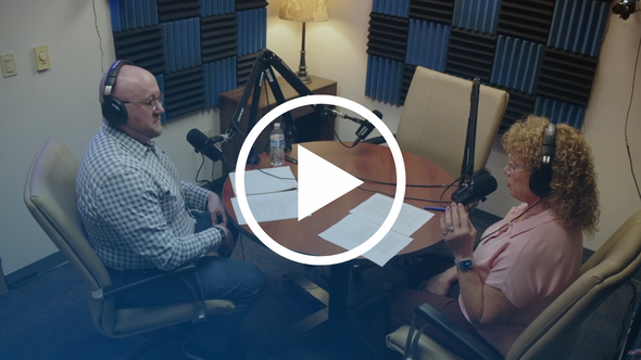 Podcast thumbnail shows two people wearing headphones and speaking into microphones.