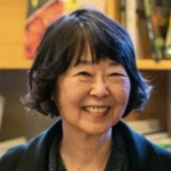 Headshot of Arlene Naganawa smiling at the camera.