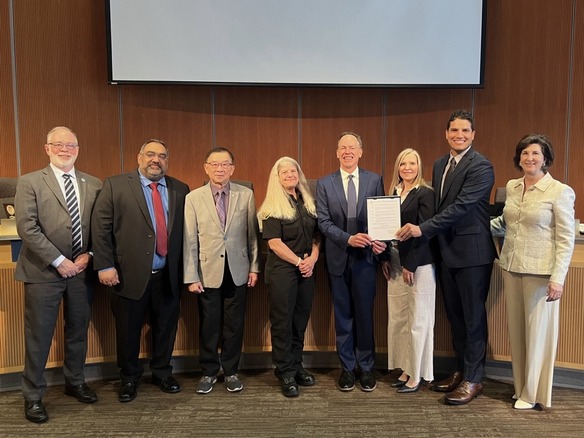 Photo of Bellevue City Council with representatives to accept the 2025 Building Safety Month Proclamation 