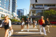 Pedestrians cross NE 8th Street in Downtown Bellevue