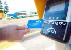 Picture of rider using ORCA card to pay fare at a Swift Station