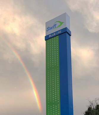 Rainbow over Swift sign at Everett Station