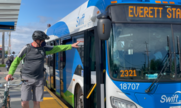 Community Transit CEO Ric Ilgenfritz waves to a bus driver