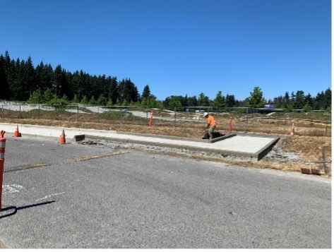 Crews continue to build temporary bus loading area south of McCollum Park Athletic Field