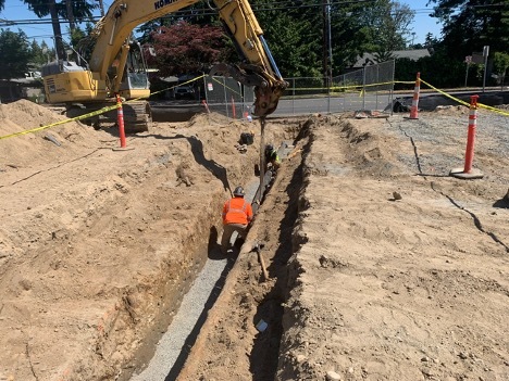 Crews have continued upgrading and relocating utilities at Edmonds College before they begin pouring concrete for the upgraded parking lot