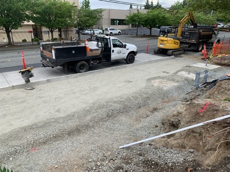 Crews work on utility upgrades where buses will stop on 33rd Ave W. 