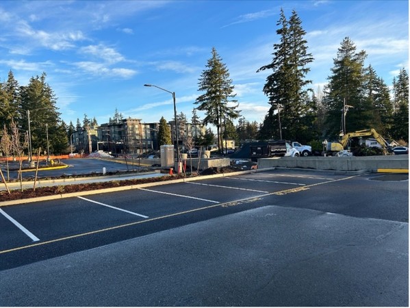 Completed parking lot, landscaping, and pedestrian pathways at Edmonds College.