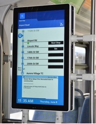 New onboard digital signage showing upcoming stops and departure times.