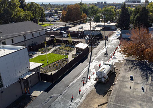 Fresh asphalt on the alley behind the Christian Aid Center in Walla Walla