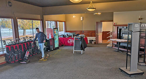 An employee vacuums in the former Pro Shop at Veterans Memorial Golf Course