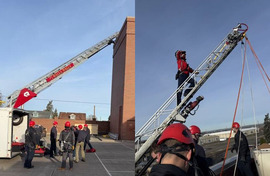 Fire personnel train with a ladder truck and a drill tower