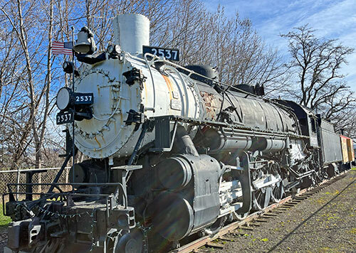 Vintage locomotive, coal car, and caboose on display in Jefferson Park, Walla Walla