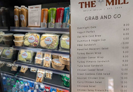 Refrigerator case with beverages and packaged, premade food