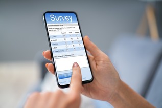 person completing survey on phone