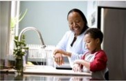 provider washing hands with child
