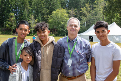 Secretary Ross Hunter visits with youth at Camp to Belong