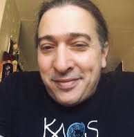 Photo of DCYF ESIT Tribal Support Specialist, Brian Frisina, smiling pleasantly at the camera.