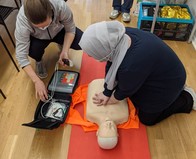 woman doing CPR 