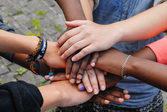 Many hands come together in show of teamwork and partnership. 