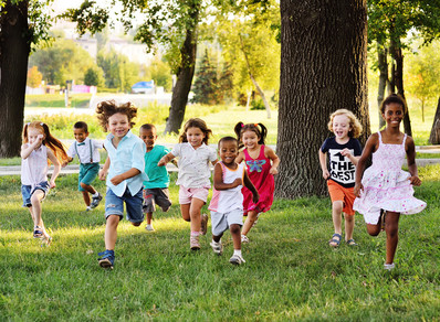 Children running and playing outdoors. 