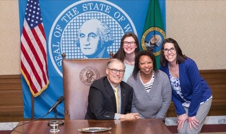 Photo of Adrienne O'Brien, Debi Donelan and Terri Jenks-Brown posing with Gov. Jay Inslee, circa 2016