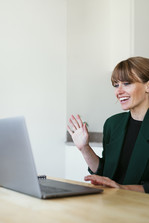 Woman presenting in front of a computer 