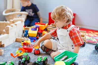 Young child playing with blocks in preschool setting