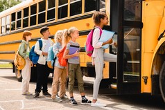 Children getting onto school bus