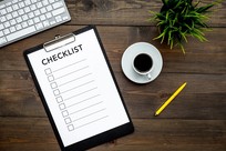 picture of desk with clipboard and a checklist