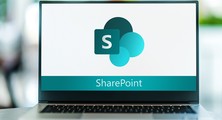 Computer screen with Microsoft graphic for SharePoint on screen