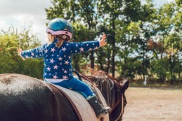 child riding a pony