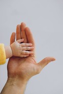 Adult hand with child hand 