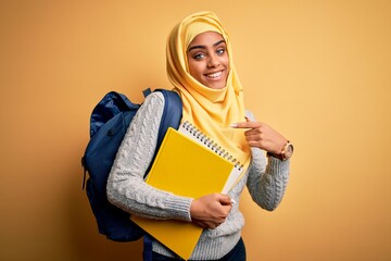 Arab American student with a notebook