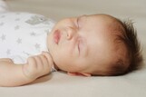 Close up shot of a sleeping infant.