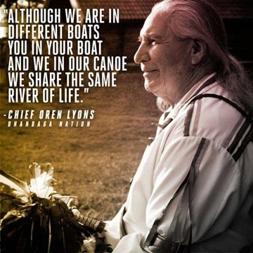 Sunlit photo of Chief Oren Lyons & quote, “Although we are in different boats you in your boat and we in our canoe we share the same river of life.” 