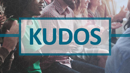 Audience clapping background picture with text overlay, "Kudos" 