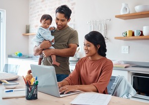 family looking at laptop screen