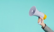 Hand is hold megaphone and wear grey suit on green or mint or Tiffany Blue background