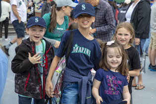 kids smiling at baseball park 