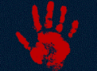 Imagery of a blood red handprint over a black background.