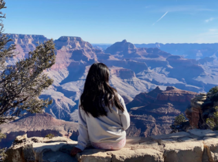 photo of a girl looking out at yellowstone national park scenery 