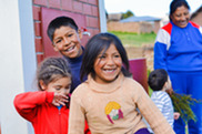 Native American Children Learning Through Play Outside.