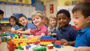 photo of children smiling in a classroom from different ethnic backgrounds