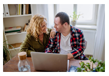 mom with son in front of laptop