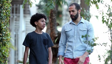 Father giving advice to son, dad and kid bonding